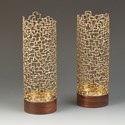 Pair of mesh, golden, tubular candlesticks