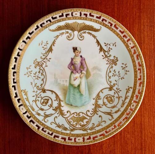 Decorative plate with painted Victorian era lady