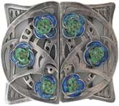 Buyers connect with an assortment of Arts & Crafts belt buckles sold recently at auction