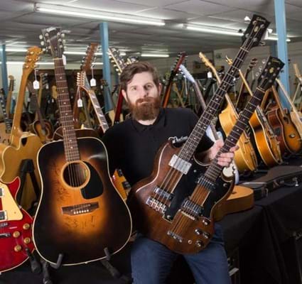 Luke Hobbs with Maurice Gibb-owned Gibson J45 (l) and Gibson doubleneck (r).jpg