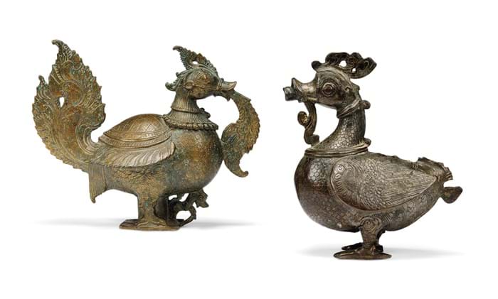 Two copper alloy models of birds