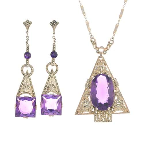 Lot 526: Theodor Fahrner: an early 20th century silver amethyst and marcasite pendant and earrings – estimate £450-650