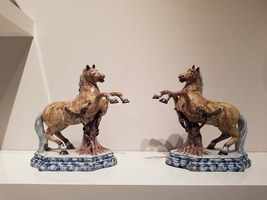 A pair of polychrome models of leaping horses from 1765