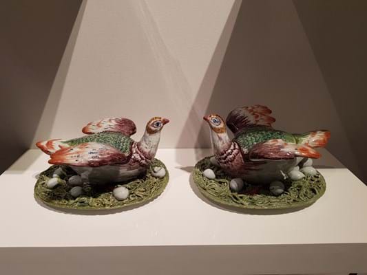 A pair of polychrome hen tureens and covers