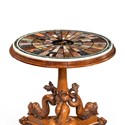 A Regency specimen marble table, on a base carved with Dolphins.jpg