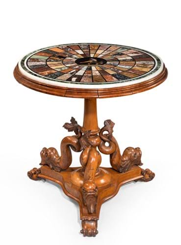 A Regency specimen marble table, on a base carved with Dolphins.jpg
