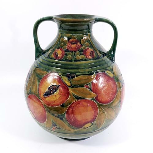 A Moorcroft Pomegranate and Roses pattern two-handled baluster vase