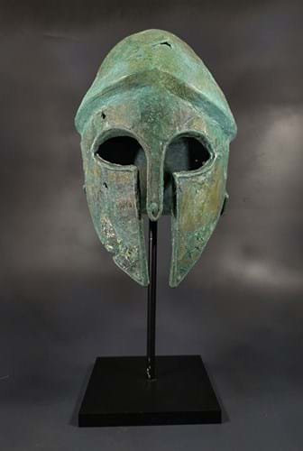 A Greek Corinthian bronze helmet