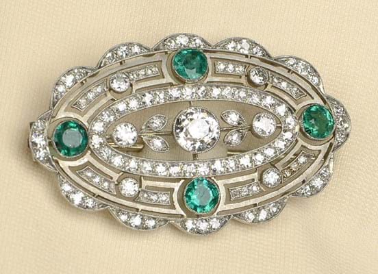 Emerald and diamond floral cluster brooch
