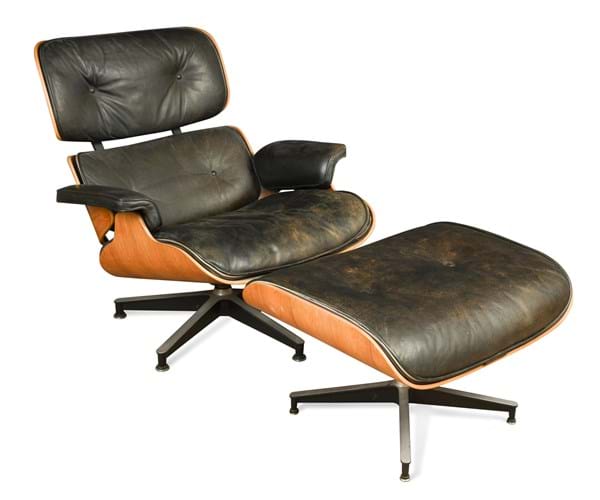 An Eames chair and stool