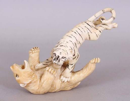 Ornament of a tiger attacking a bear
