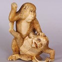 An ornament of a monkey attacking a kappa
