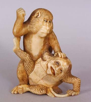 An ornament of a monkey attacking a kappa