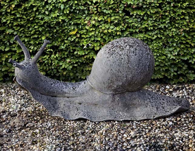 A garden sculpture of a snail