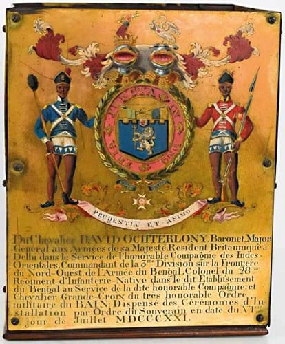 One of the brass and enamel garter stall plaques 