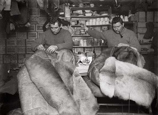 Herbert George Ponting - Petty officer Evans and Crean mending sleeping bags.jpg