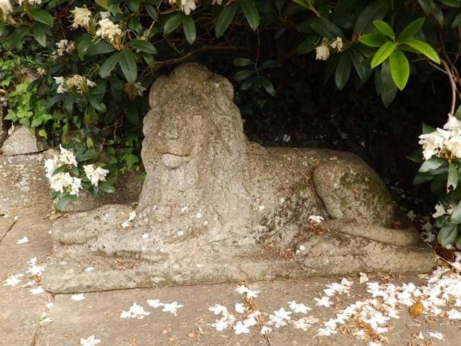A garden statue of a lion