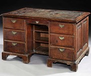 Six pieces of furniture offered by dealers including a George II partners’ desk