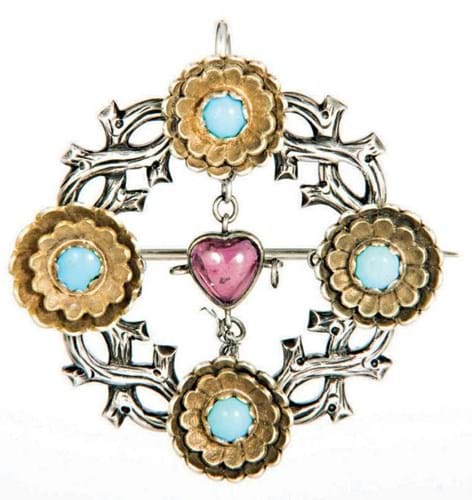 Burges brooch set with a heart-shaped garnet